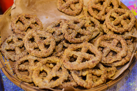 Freshly baked soft pretzels with generous sprinkling of coarse salt. Closeup with shallow dof.の写真素材