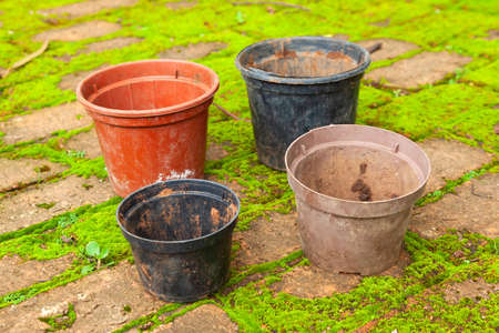 Colored empty flowers pot for gardening - mud dirt usedの写真素材