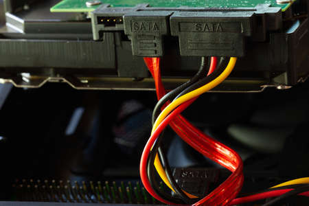 SATA connector and cables in a HDD hard disk drive closeupの写真素材