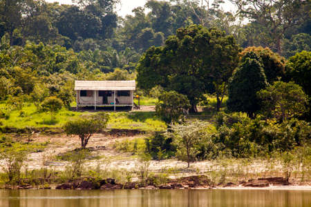 Simple house on Amazon river island