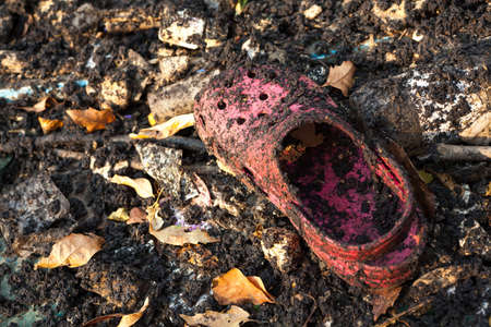 Garbage and drought soil in polluted riverの写真素材