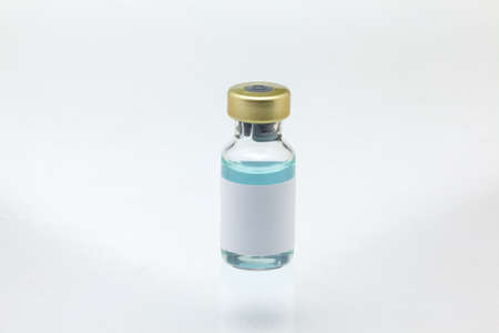 Isolated glass vaccine bottle with colored liquid very close high magnification mockup