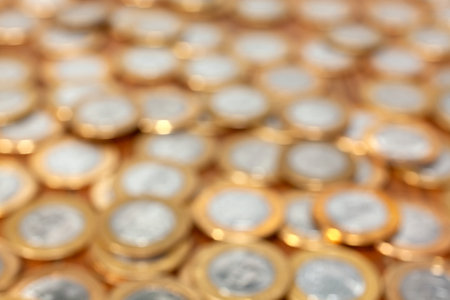 Out of focus coins for backgroundの写真素材