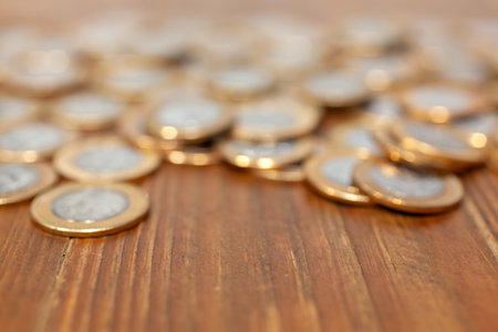 Out of focus coins for backgroundの写真素材