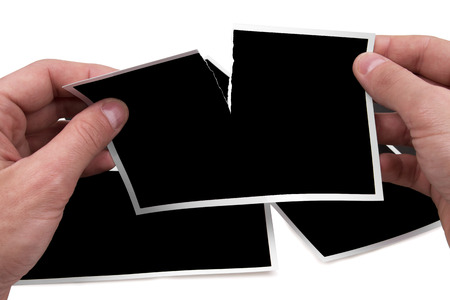 Photo Frames torn by handsの写真素材