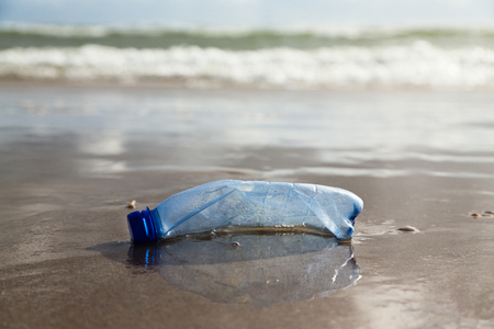 Plastic bottle on the shoreの写真素材