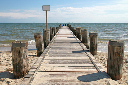wooden boardwalk at the north seaの写真素材