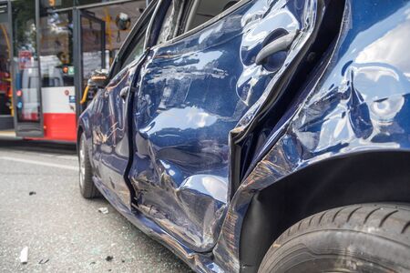 Blue car damaged by crash accidentの写真素材