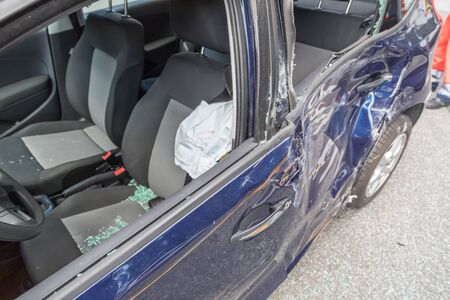 Blue car damaged by crash accidentの写真素材