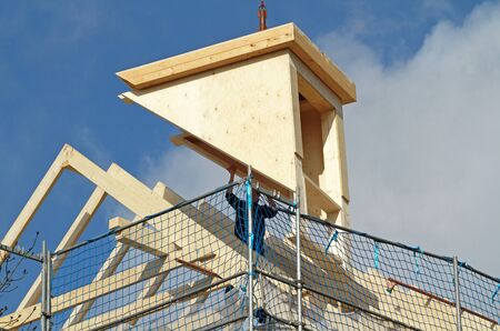 Dormer installation on rooftopの写真素材