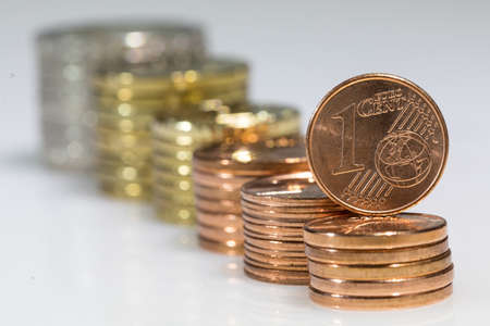 isolated stacks with euro cent coinsの写真素材