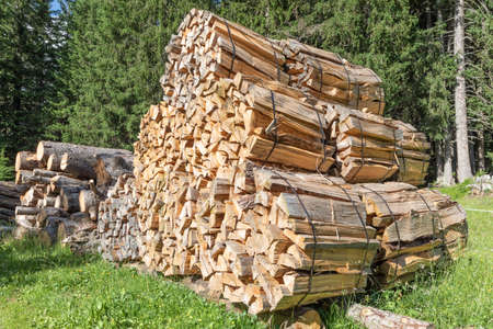 stacked packages with firewood pieces