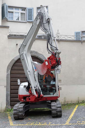 white digger on a parking spot in the cityの写真素材
