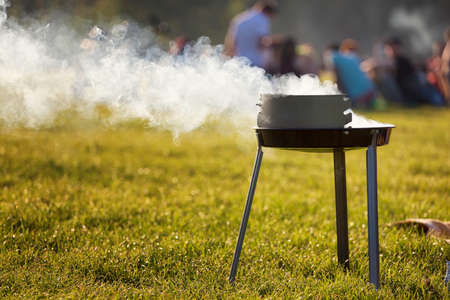 intense smoke from a charcoal grillの写真素材