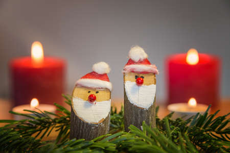 christmas figures with red candlesの写真素材