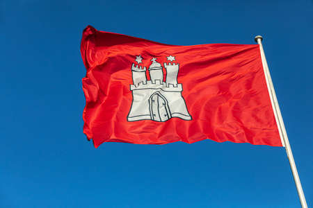 Flag of the city-state of Hamburg in the windの写真素材