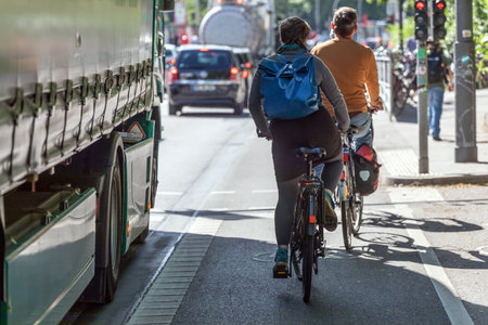Truck overtakes cyclist on bike laneの写真素材