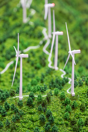 Small plastic wind turbines in a landscape model