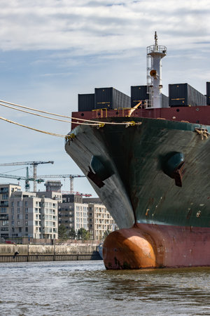 Container ship lies on the Elbe in Hamburgの写真素材