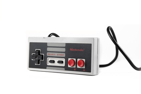Springfield, Missouri - January 9, 2011: A studio shot on a solid white background of a Nintendo Entertainment System controller.のeditorial素材