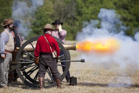 Battlefield, Missouri, USA - August 11, 2012: Civil war re-enactors fire off a cannon at Wilson's...