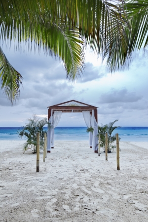 Beach wedding archway on a tropical resort.の写真素材
