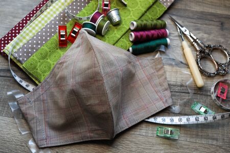 Fabric facemask produced at home on a sewing machine, because of the shortage of protection...