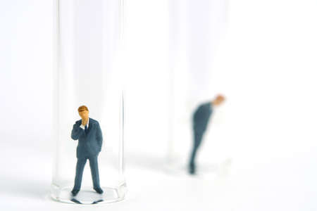 Health conceptual miniature people photography â testing specimen, a businessman on a laboratory tube. Image Photoの写真素材