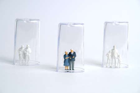 Pandemic corona virus conceptual miniature people photography â€“ social distancing strategy -...