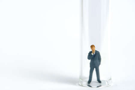 Health conceptual miniature people photography â testing specimen, a businessman on a laboratory tube. Image Photoの写真素材