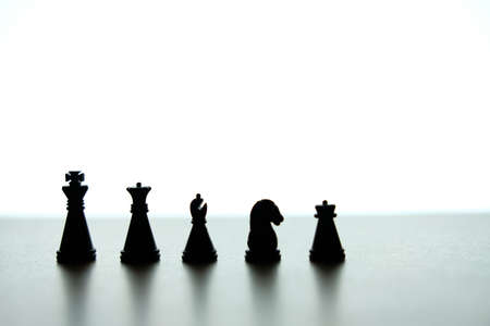 Business strategy conceptual photo - Silhouette of a chess pawn knight in a rowの写真素材