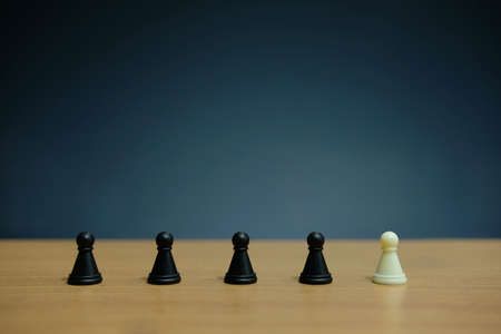 Business strategy conceptual photo - white pawn chess on black pawn chess lineの写真素材