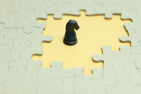 Business strategy conceptual photo - horse knight standing in front of jigsaw piece puzzleの写真素材