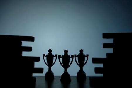 Business strategy conceptual photo â Silhouette of trophy stand in the middle of jigsaw puzzleの写真素材