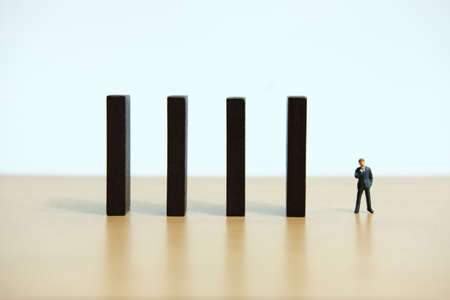 Business strategy conceptual photo - Miniature of businessman stands at the edge of wooden bridge staircaseの写真素材