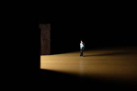 Business conceptual photo â€“ miniature of businessman entering office building