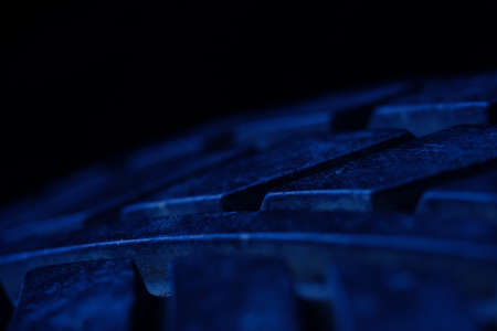 Abstract macro photography, close up tire texture pattern with blue lightの写真素材
