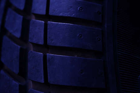 Abstract macro photography. Close up tire texture pattern with purple lightの写真素材