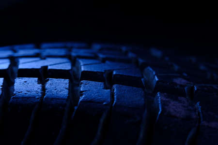 Abstract macro photography. close up scratch and hole tire texture pattern with blue light tone colorの写真素材