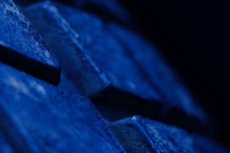 Abstract macro photography, close up tire texture pattern with blue lightの写真素材