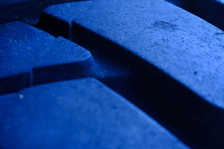 Abstract macro photography. Close up tire texture pattern with blue light, cold tone colorの写真素材