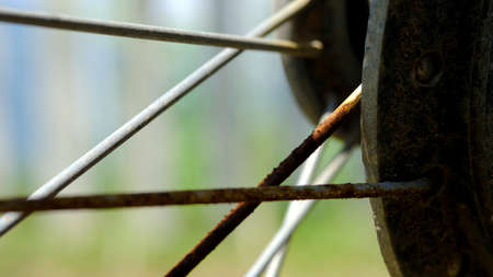 Detail macro automotive photography. close up old rustic wheel barsの写真素材
