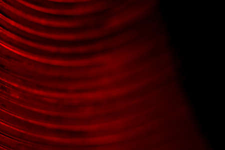 Abstract macro photography. Red round line glass lamp texture