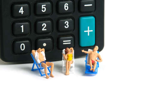 Miniature people toy figure photography. Budget and Financial Plan for travel. Group of men and girl...