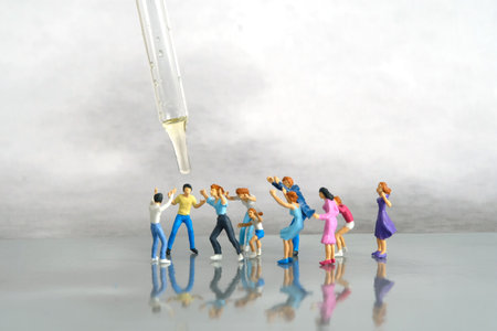 Miniature people toy figure photography. Group of people jostling for vaccine. Image photoの写真素材