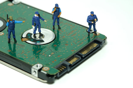 Miniature people toy figure photography. Data protection concept. A security officer standing above...