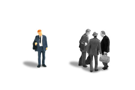 Miniature people toy figure photography. Office gossip concept. A businessman worker talking about someone. Isolated on white background. Image photoの写真素材