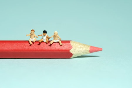 Miniature tiny people toy figure photography. Art study and learning concept. Group of boy toddlers...