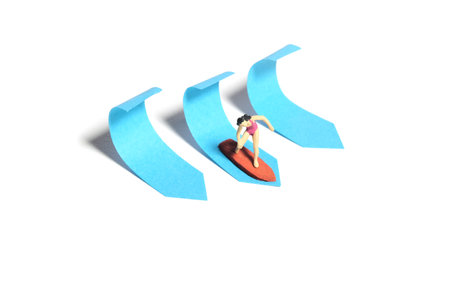 Creative miniature people toy figure photography. Sticky notes installation. A girl surfer riding big waves on surfing board. Isolated on white background. Image photoの写真素材