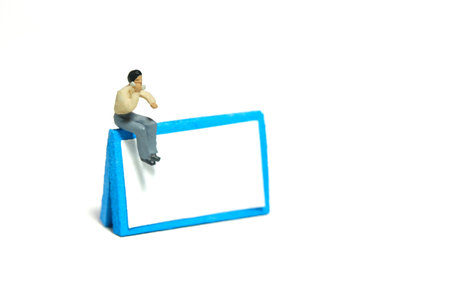 Miniature tiny people toy figure photography. Phone call schedule reminder illustration concept. A...